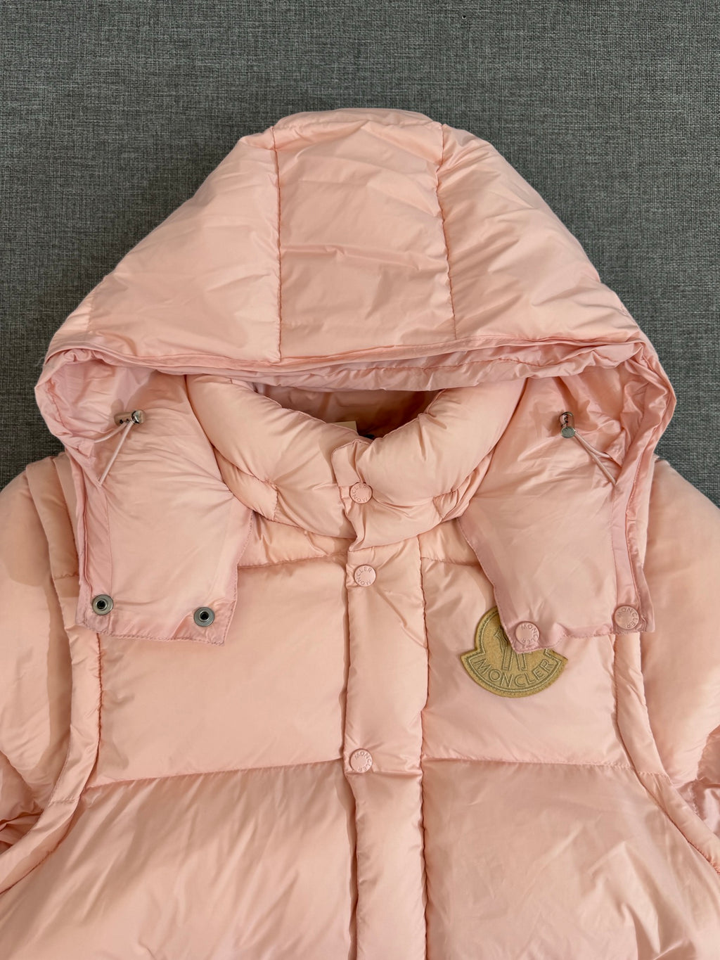 Moncler long puffer jacket, pink hood with front buttons and gold logo patch