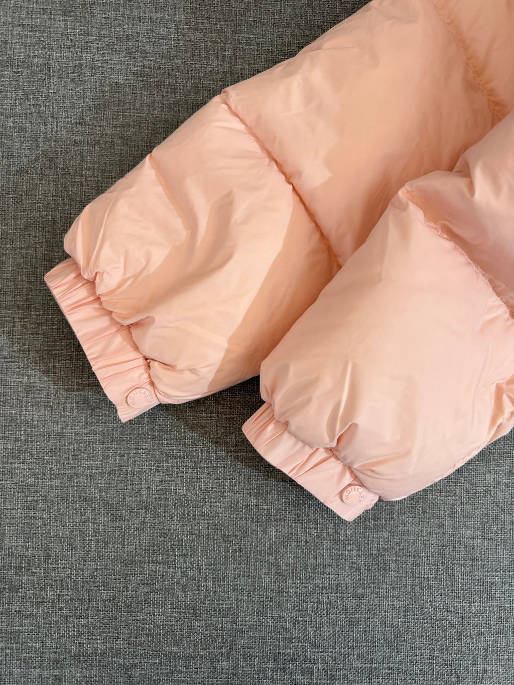 Moncler long puffer jacket, pink padded cuffs with snap buttons on quilted fabric