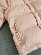 Moncler long puffer jacket, close-up of side zip pocket on pink quilted sleeve