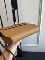 Hermes tan leather bag with strap and metal top handle clasp