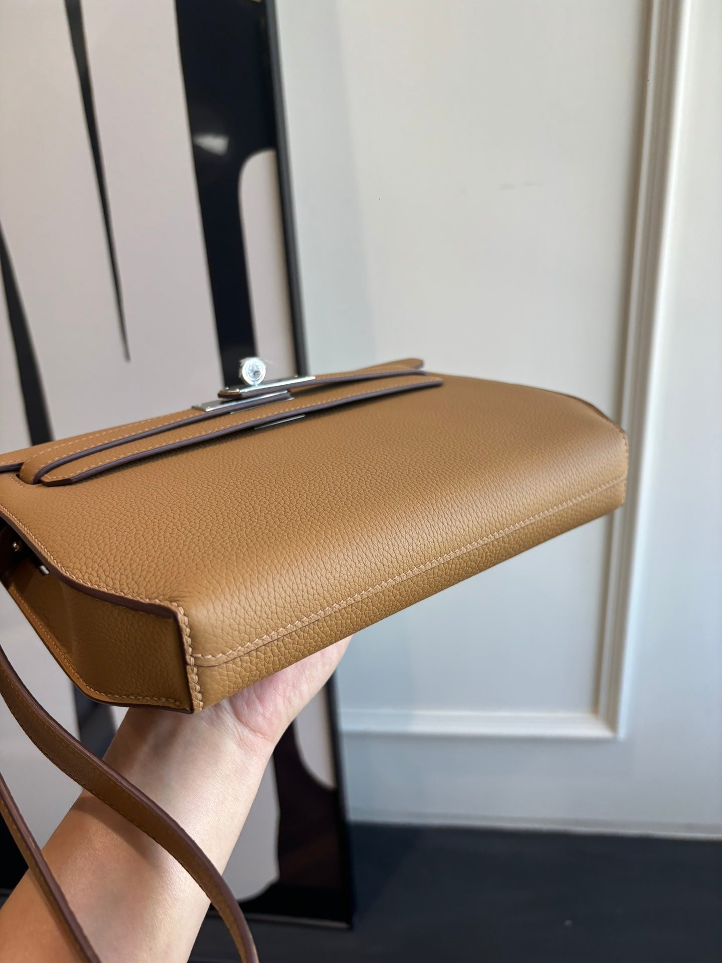 Hermes tan leather bag with strap and metal top handle clasp