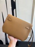 Hermes tan leather flap bag with two front flap tabs