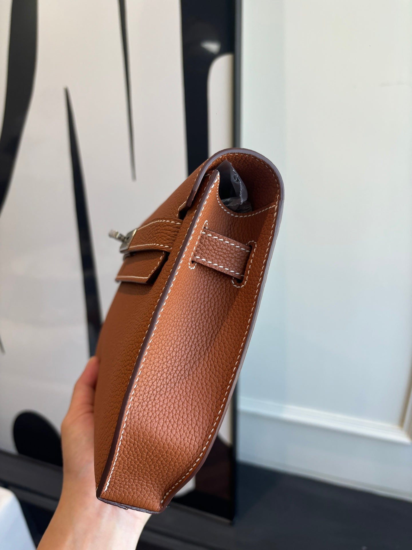 Hermes brown leather flap bag with side profile and short strap