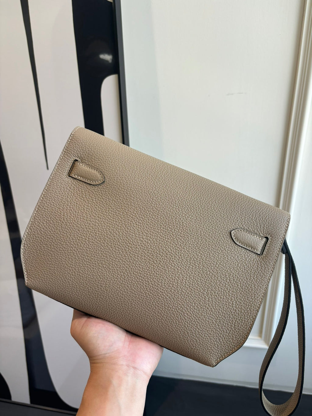 Hermes textured taupe leather flap bag with small front pocket and strap loops
