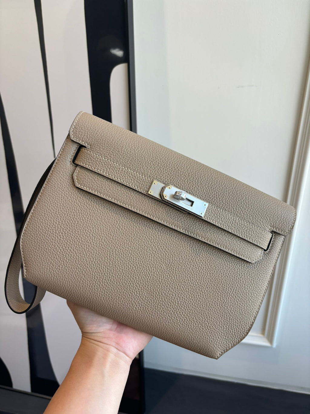 Hermes shoulder bag in taupe textured leather with flap and silver-tone clasp hardware