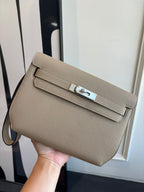 Hermes shoulder bag in taupe textured leather with flap and silver-tone clasp hardware