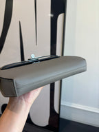 Hermes bag top view with short handle and light blue-gray textured leather body
