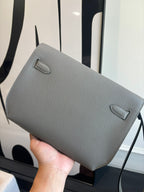 Hermes bag with fold-over flap, light blue-gray textured leather and small front tab