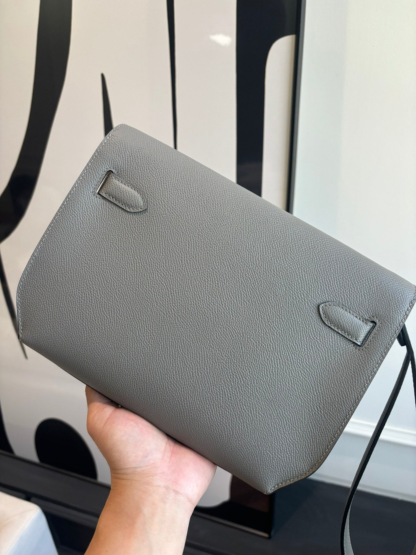 Hermes bag with fold-over flap, light blue-gray textured leather and small front tab