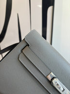 Hermes bag front, textured leather with double stitched flap and gold-tone clasp