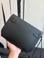 Flap bag front view with two fold-over corners and textured surface, dark blue