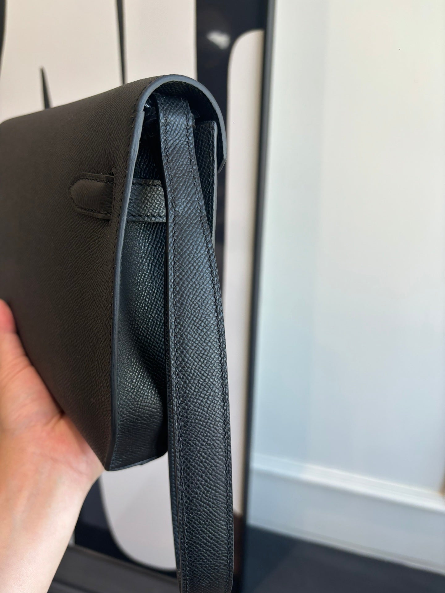 Hermes bag side view showing top handle strap and interior lining