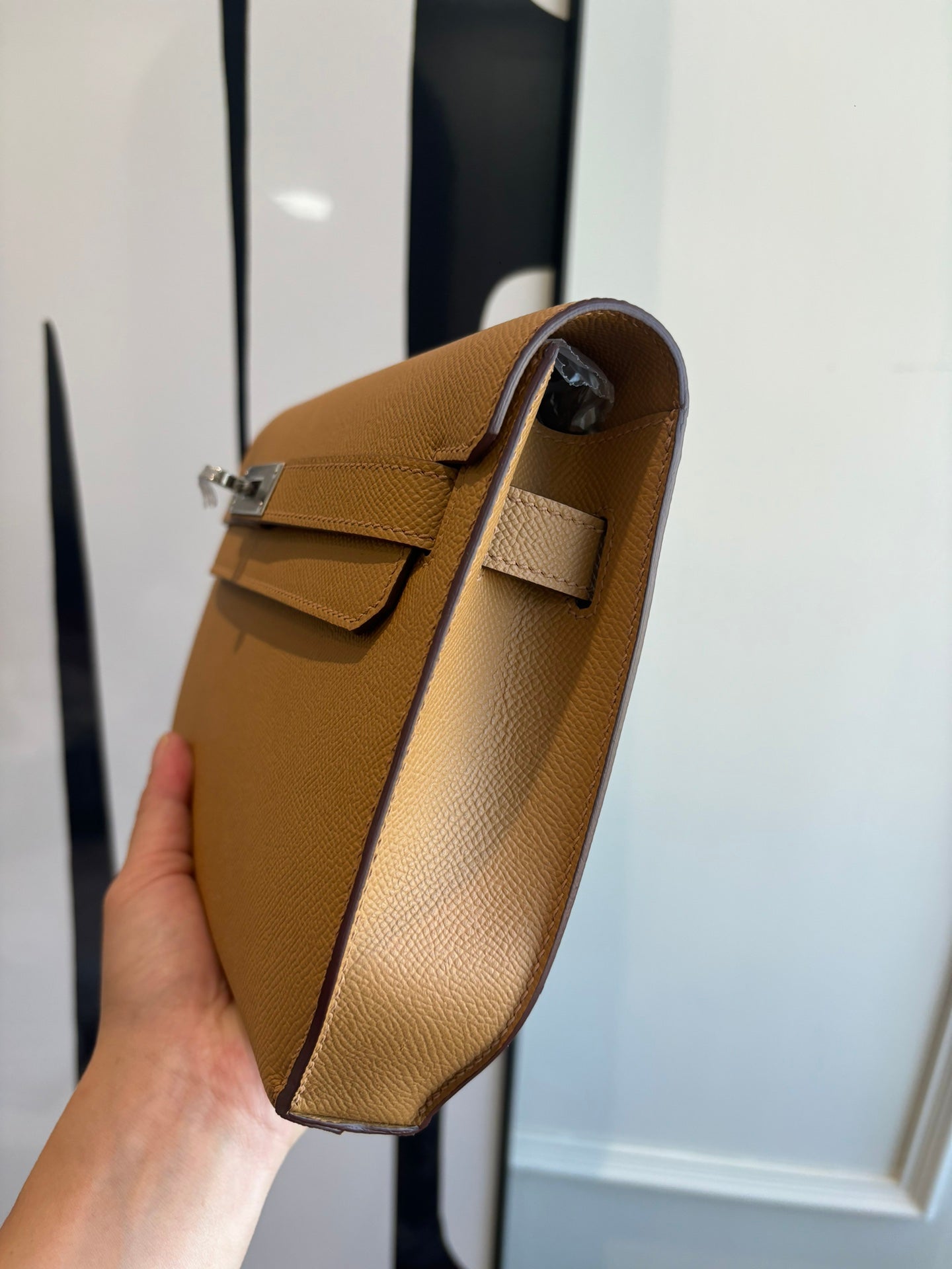 Hermes tan leather flap bag with adjustable strap and silver side clasp