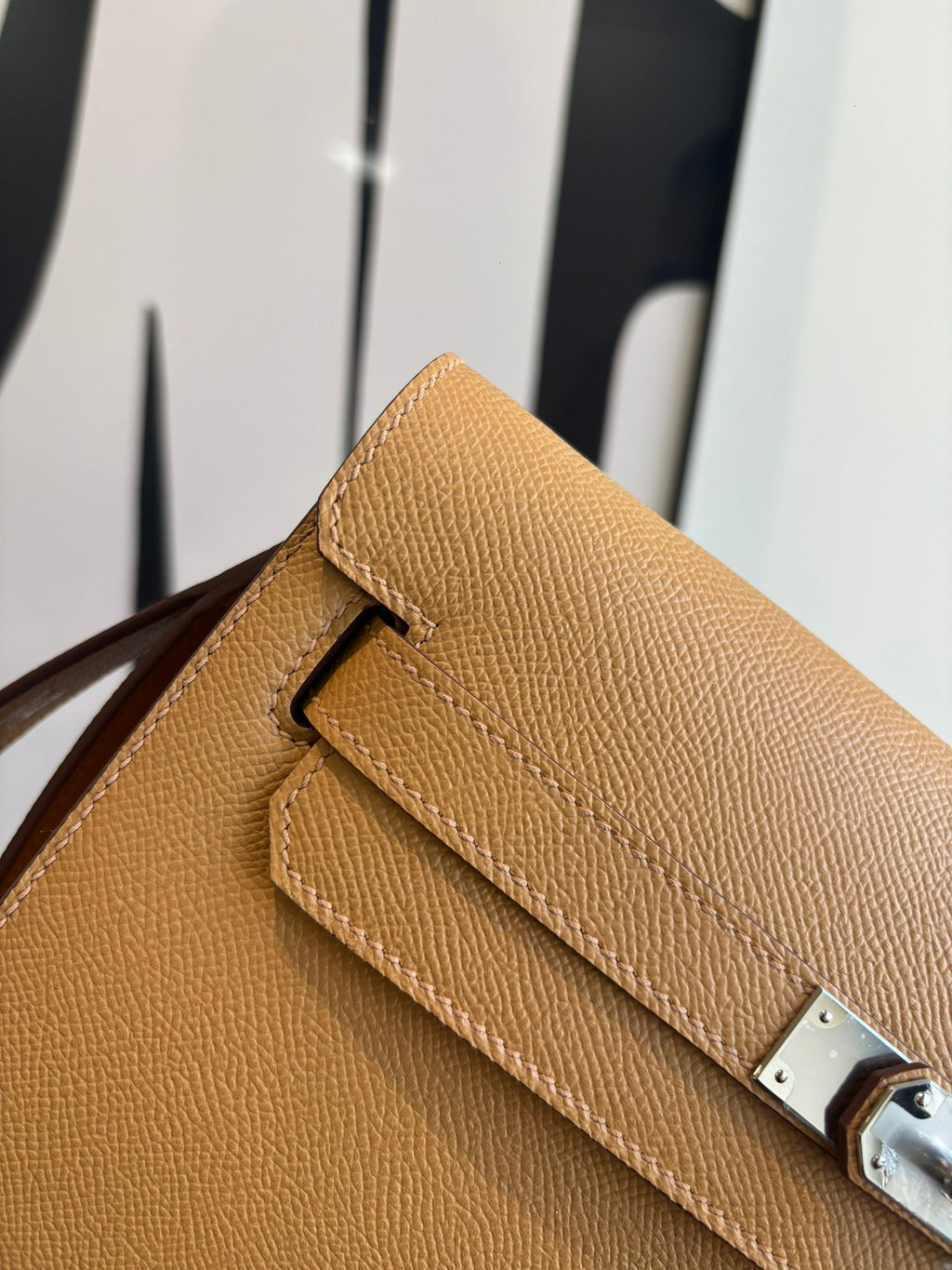 Hermes tan textured leather flap bag with silver lock and stitched trim