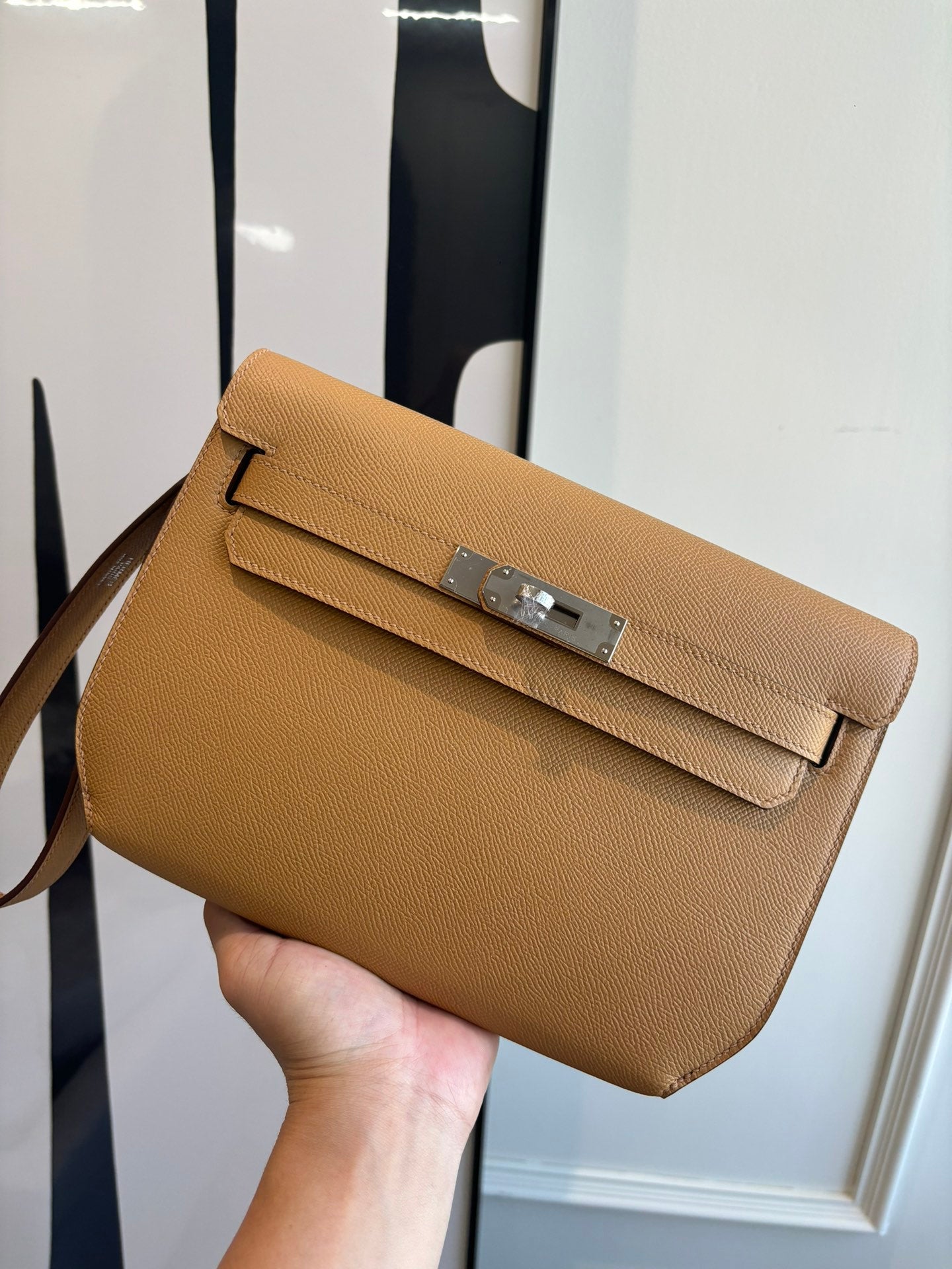 Hermes tan leather crossbody flap bag with front silver buckle clasp