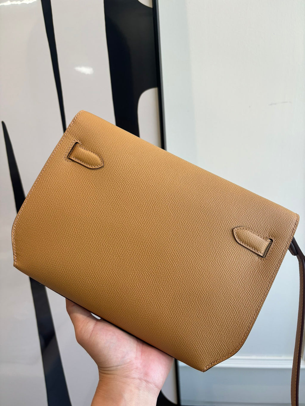 Hermes tan leather flap bag with two front strap loops