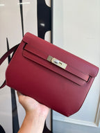 Hermes red leather shoulder bag with flap and silver-tone front clasp