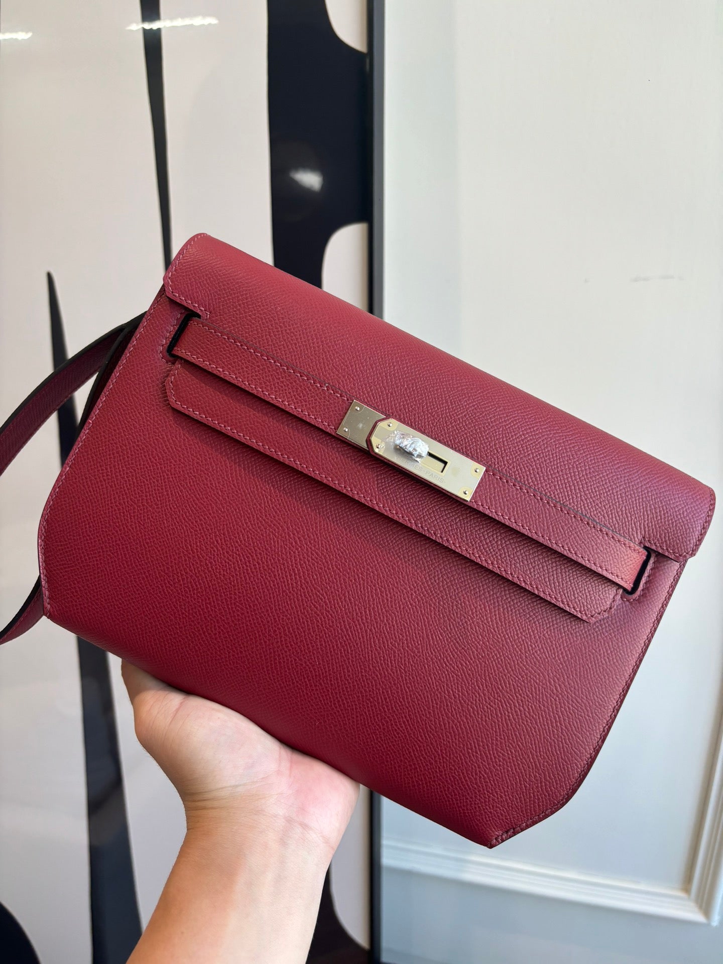Hermes red leather shoulder bag with flap and silver-tone front clasp