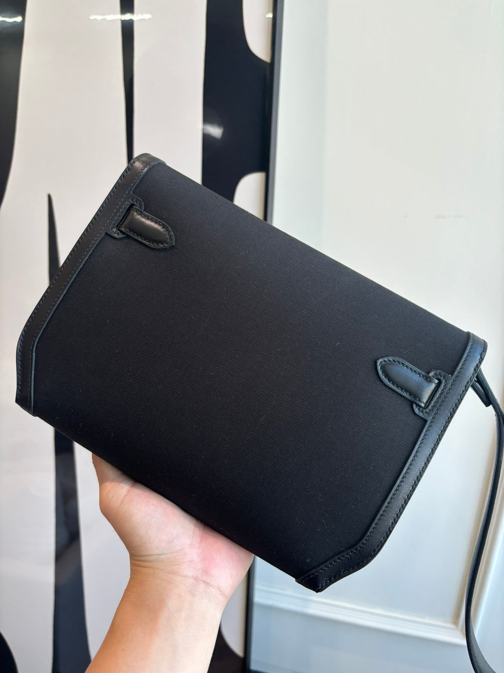 Hermes small shoulder bag with curved top flap and short front strap tab