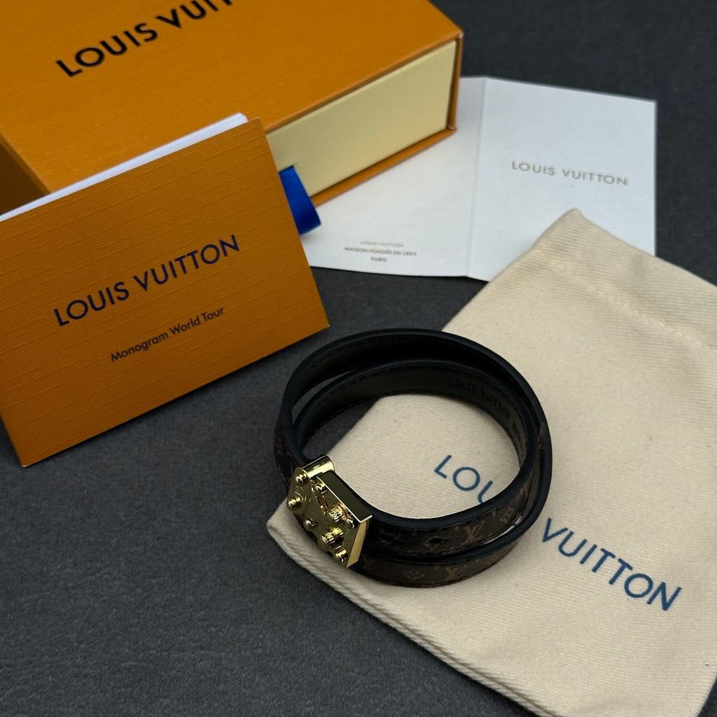 Louis Vuitton monogram leather bracelet with gold-tone buckle clasp, black.
