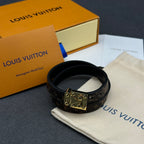 Louis Vuitton monogram leather bracelet with gold-tone buckle clasp, black.