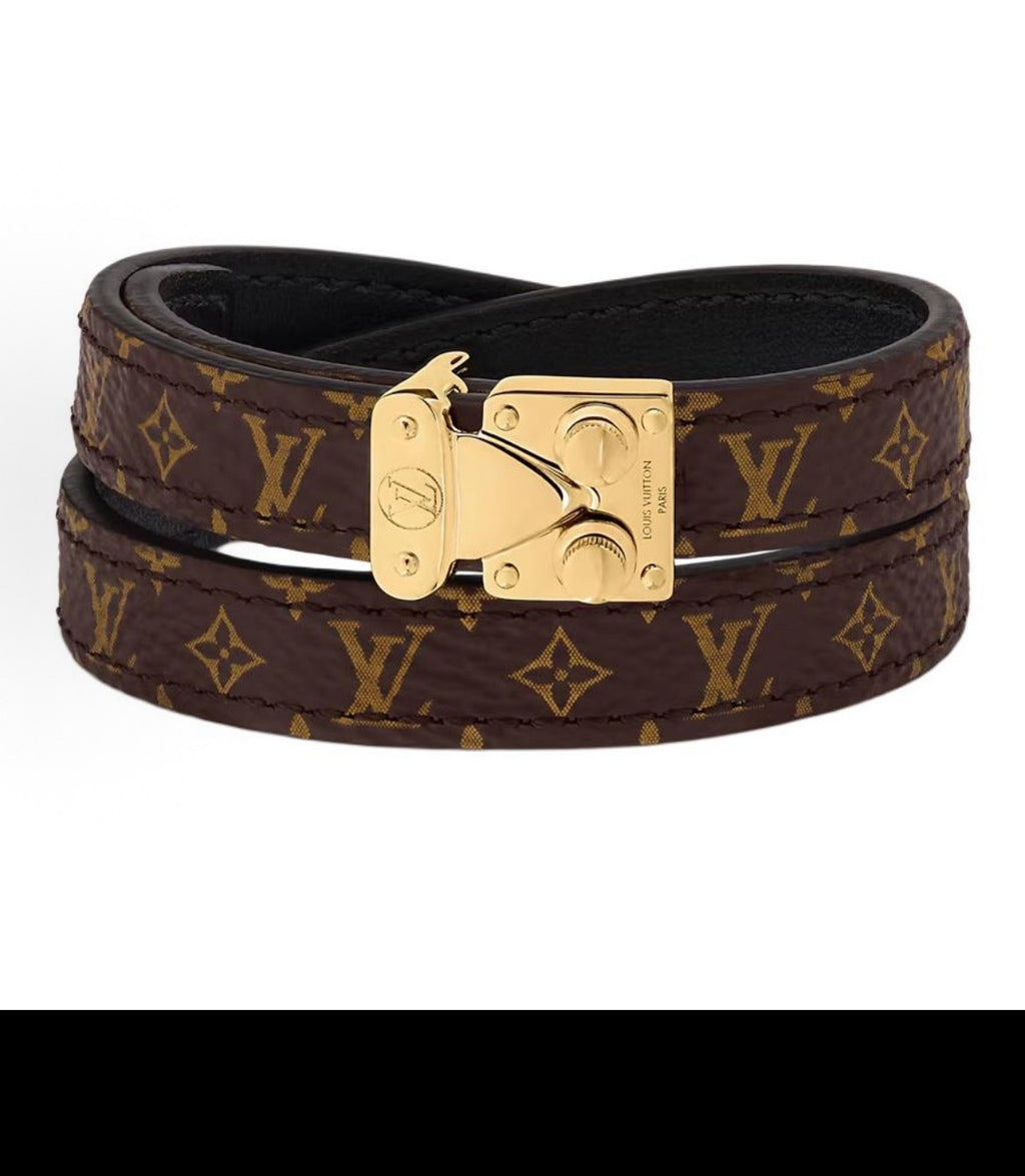 Louis Vuitton monogram leather bracelet with gold-tone clasp, brown and dark.
