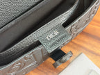 Inside label on Dior crossbody bag reading “Dior” and “Made in”