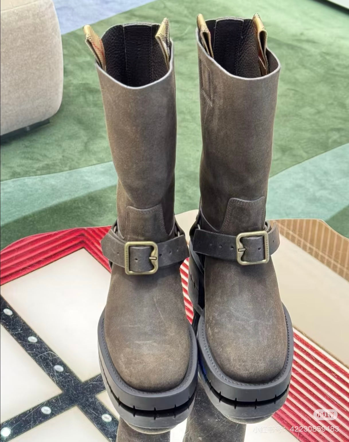 Taupe suede tall boots with two buckle straps and thick tread sole