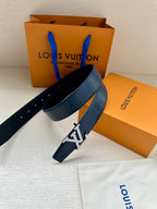 Louis Vuitton belt, dark blue embossed leather with large silver LV buckle and pin