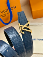 Blue leather belt with gold buckle detail, textured strap