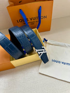 Blue leather belt with gold buckle clasp, embossed strap shown