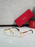 Prada eyeglasses with gold metal frame and black temple arms, clear lenses