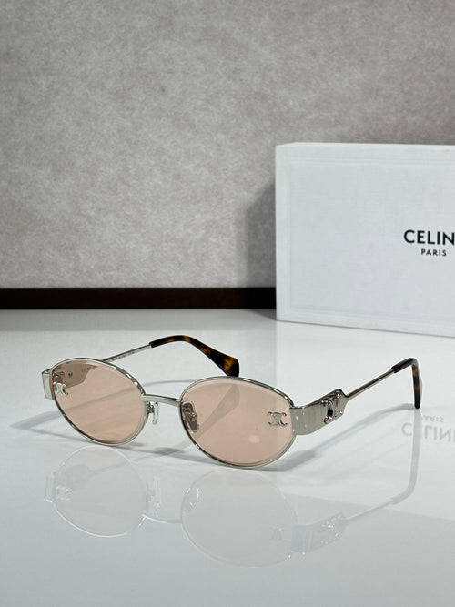 Round sunglasses with clear rose-tinted lenses and metal arms