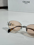 Round sunglasses with silver frame and light brown gradient lenses