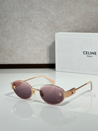 Round sunglasses with rose gold frame and purple tinted lenses