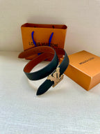 Louis Vuitton belt with dark blue strap and gold LV buckle, shown folded