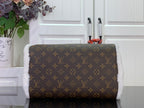 Monogram canvas handbag with white fuzzy lining and top zip, gold-tone hardware