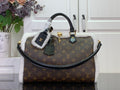 Monogram canvas handbag with black handles and white fuzzy trim, gold-tone hardware