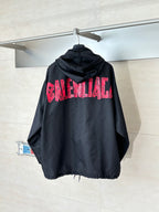 Black long hooded jacket with pink BALENCIAGA logo on back