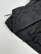Black parka jacket with front pocket and adjustable drawstring waist