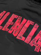 Black jacket fabric with bold pink typographic graphic print