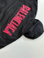 Balenciaga long-sleeve jacket, black with pink logo graphic on sleeve