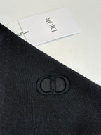 Black Dior long-sleeve jacket fabric with embroidered logo on sleeve
