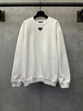 White long-sleeve sweatshirt with small Prada triangle logo at chest