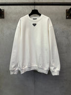 White long-sleeve sweatshirt with small Prada triangle logo at chest