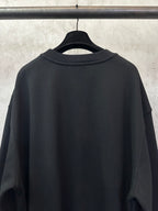 Black sweatshirt back view with ribbed crew neck and long sleeves
