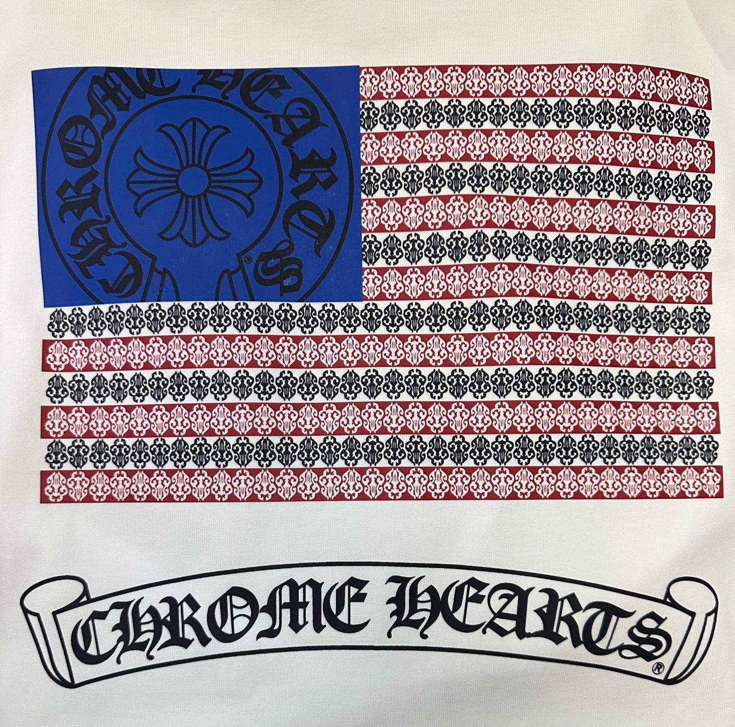 Cream T-shirt fabric print with blue, red, and ornamental stripe bands