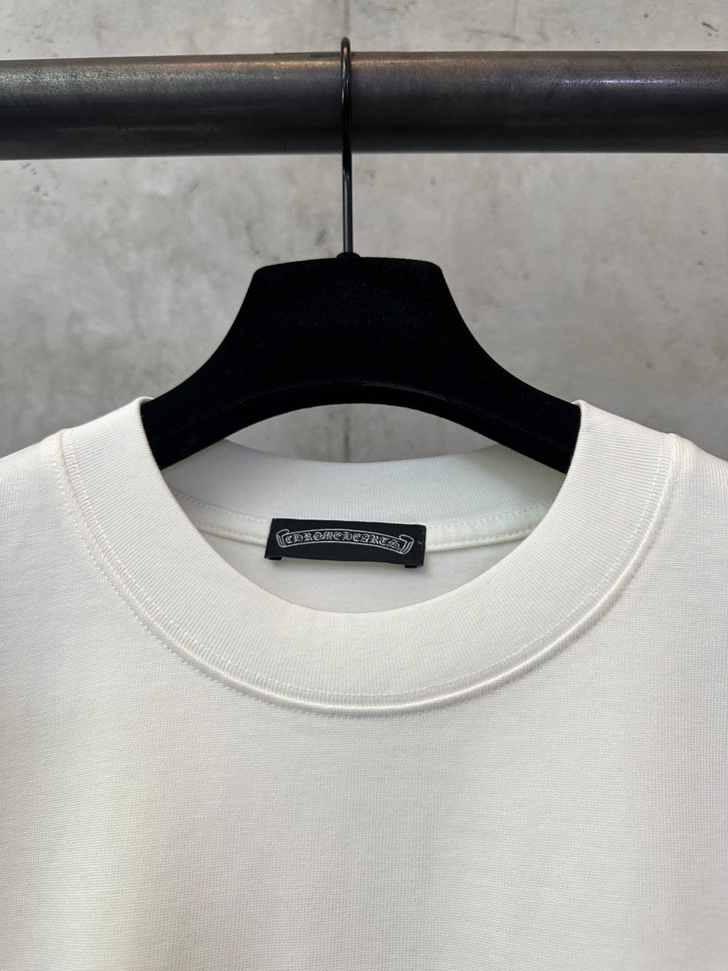 Cream crewneck T-shirt neckline with internal brand label