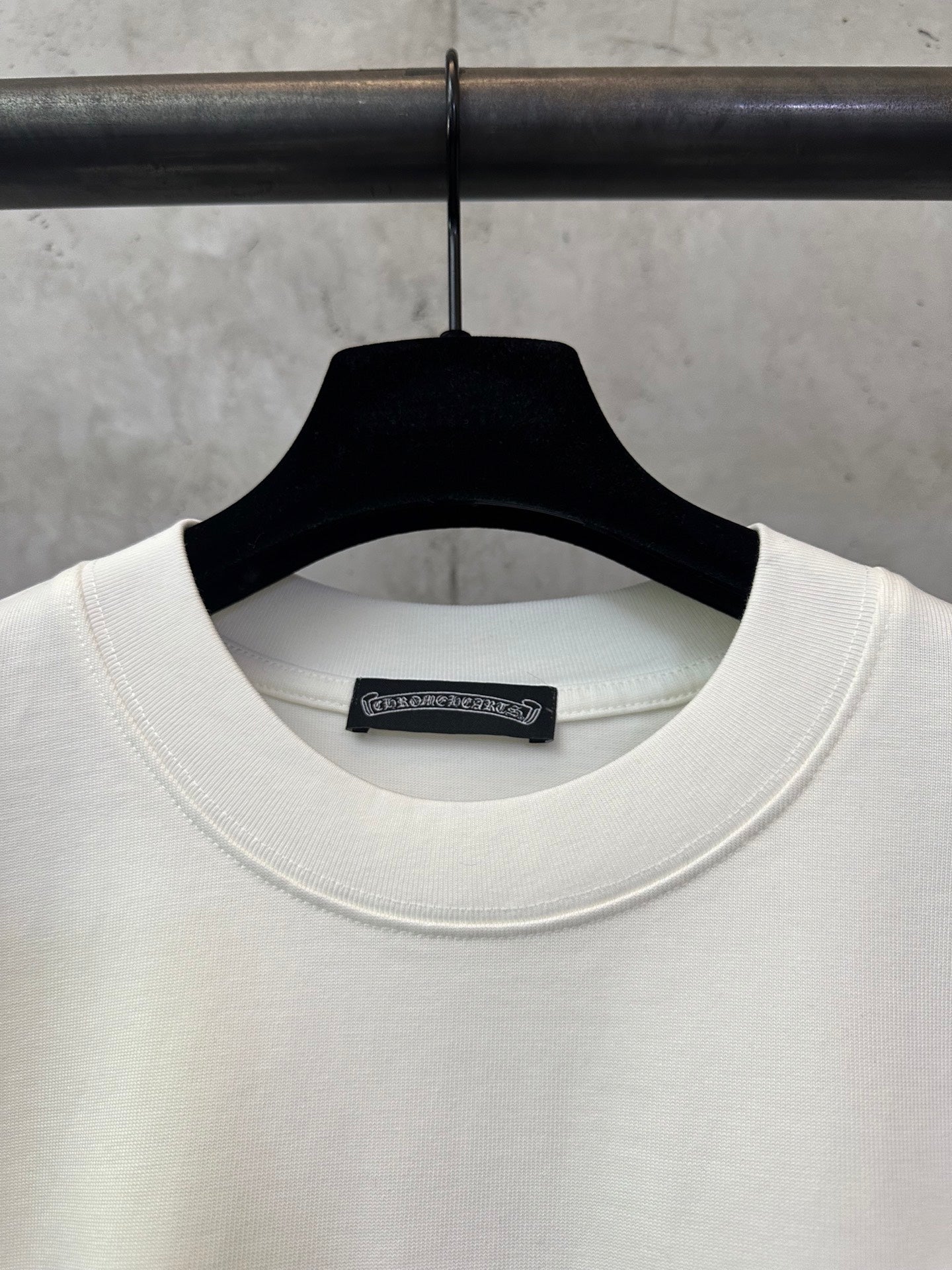 Cream crewneck T-shirt neckline with internal brand label