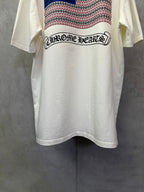 Cream T-shirt back with arched logo text over patterned stripe panel